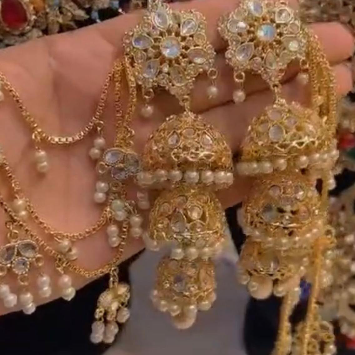 Golden bahubali jhumka with three layer sahare earring